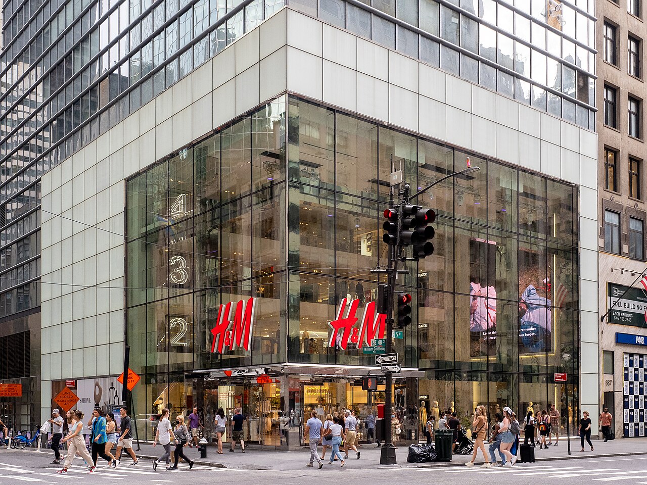 H&M flagship store exterior with glass facade and red H&M logo signage
